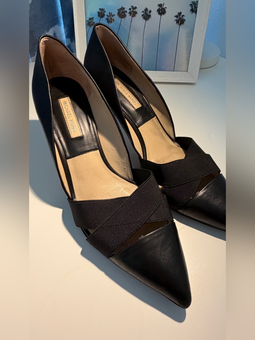 Michael Kors Stephanie crisscross calf skin leather pointed-toe pumps in black.